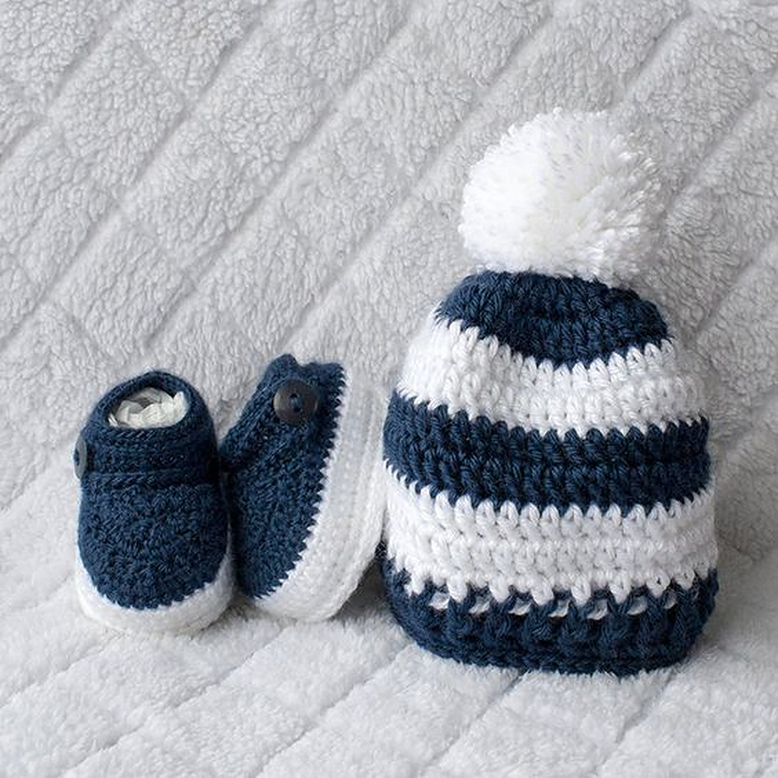 Crochet baby winter set with navy blue and white cap and booties